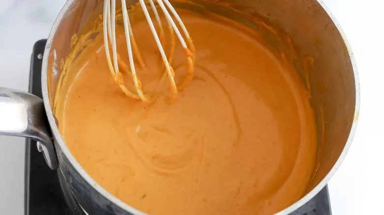 تصویر مرتبط با طرز تهیه فرنی کدو حلوایی با پسته؛ دسر پاییزی خوشرنگ و خوشعطر در لیوانهای تکنفره