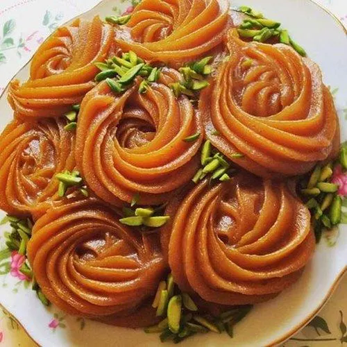 تصویر مرتبط با دستور تهیه حلوای خرمالو خوش‌رنگ و خوش‌طعم با عطر هل و گلاب